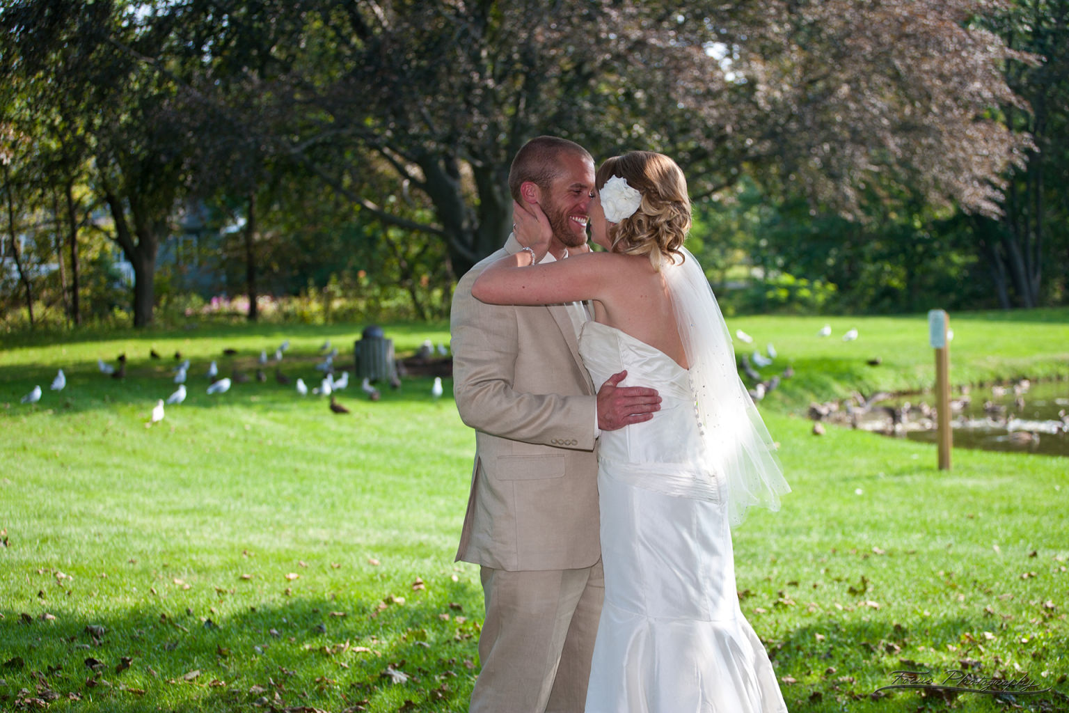 Bride and groom laughing at Maine park