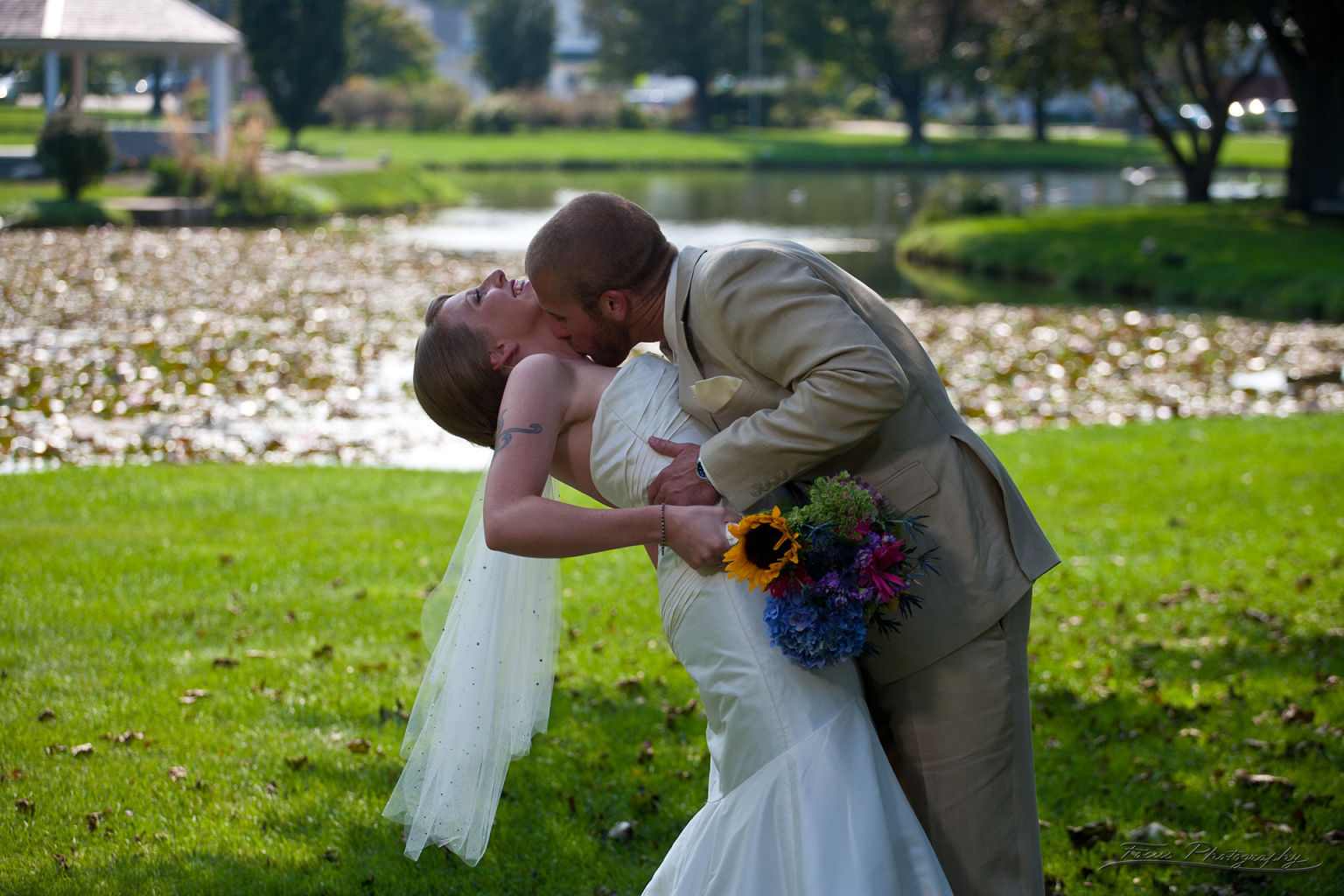 Groom kissing bride in South Portland Maine