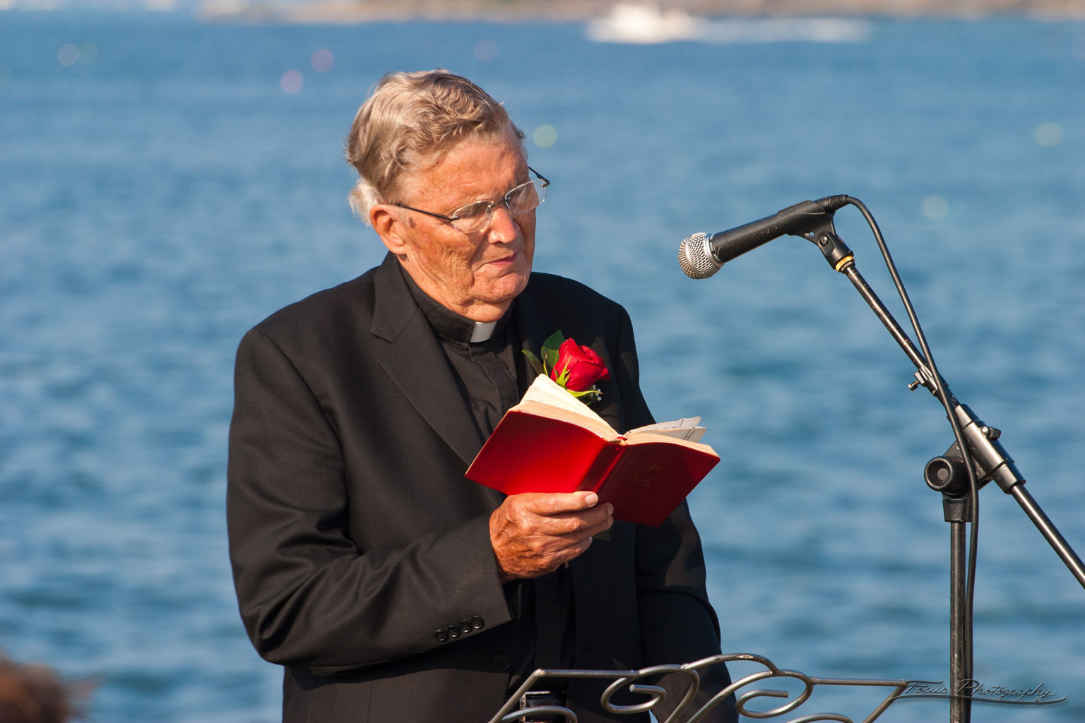 Minister reading at Maine wedding