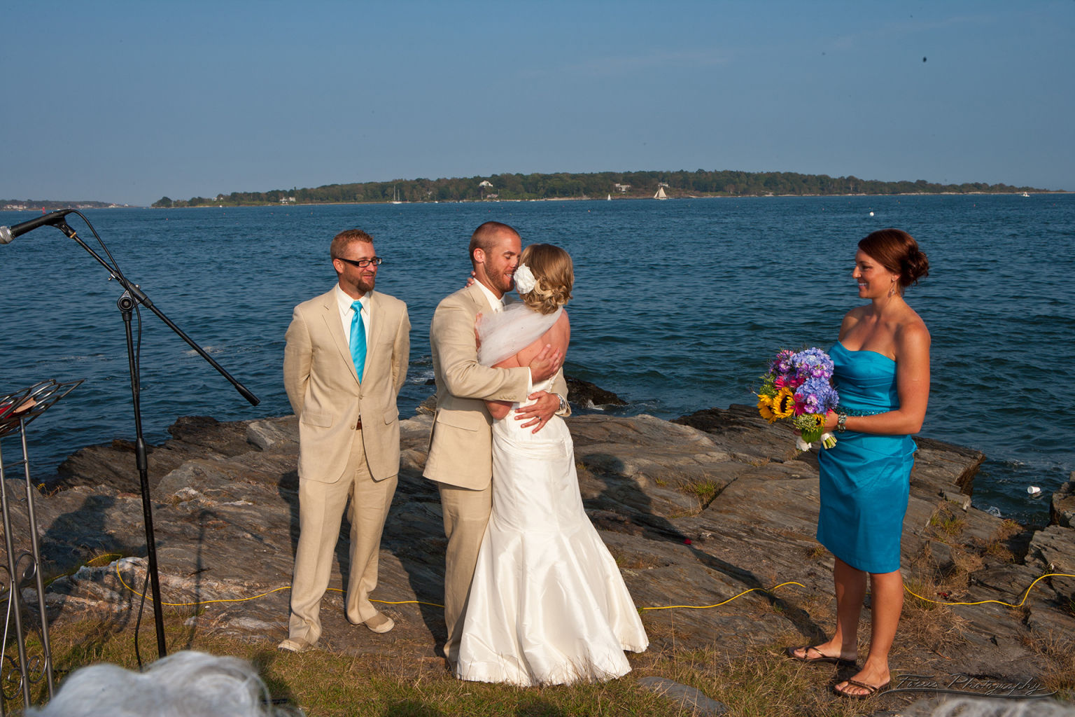 Bride and groom kissing at Casco Bay Maine wedding