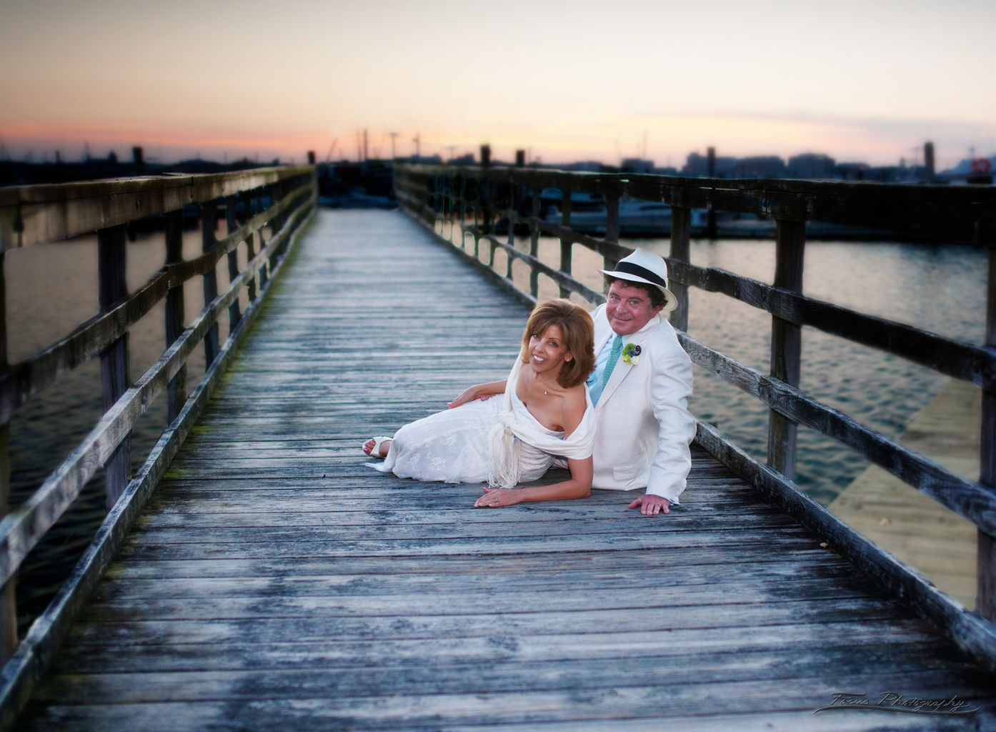 Bride and groom on dock at Maine wedding