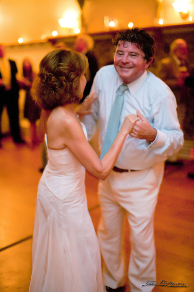 bride dancing with man at Maine wedding reception