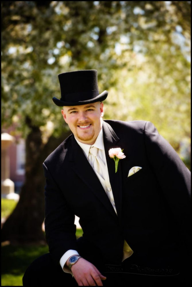 groom in top hat by north shore wedding photographers Focus Photography