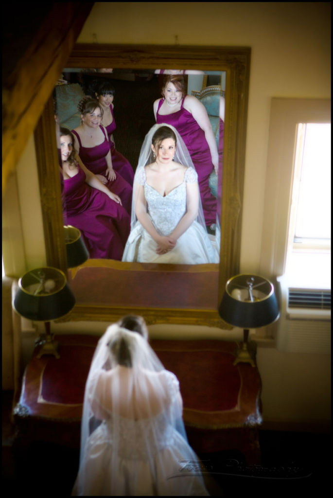 bride in mirror during wedding photography in Newburyport, massachusetts