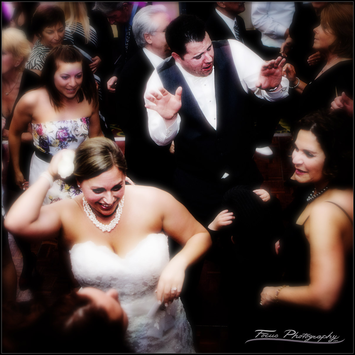 Bride and Groom dancing with guests
