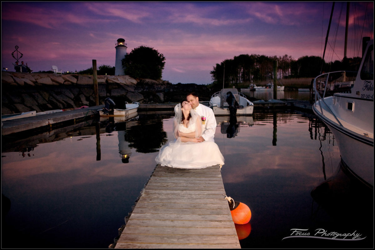 The bride and groom on the docks at Kennebunkport, Maine. Wedding photographers Will and Lucia