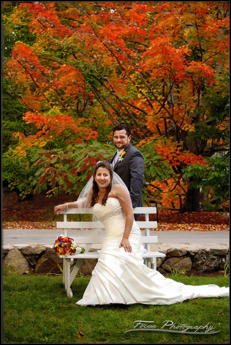 Wedding portraits at Colony Hotel in Maine with fall foliage