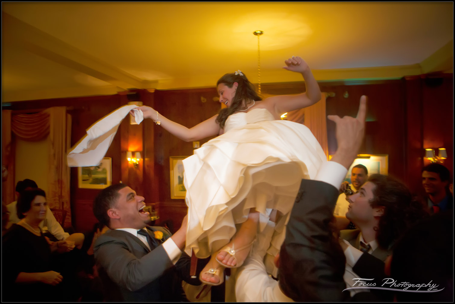 bride lifted during dance at wedding reception at Maine's Colony Hotel