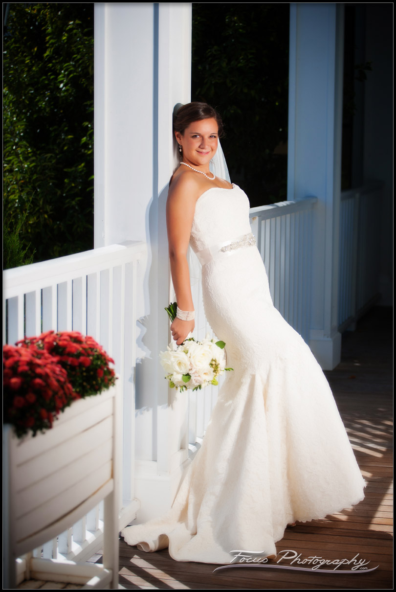 bridal portrait on porch at wentworth by sea in new castle, NH