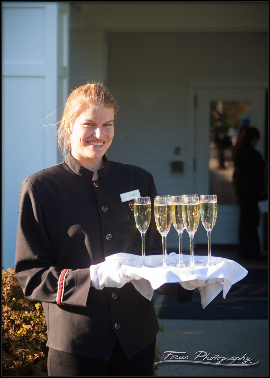 server holds champagne at wentworth by sea wedding