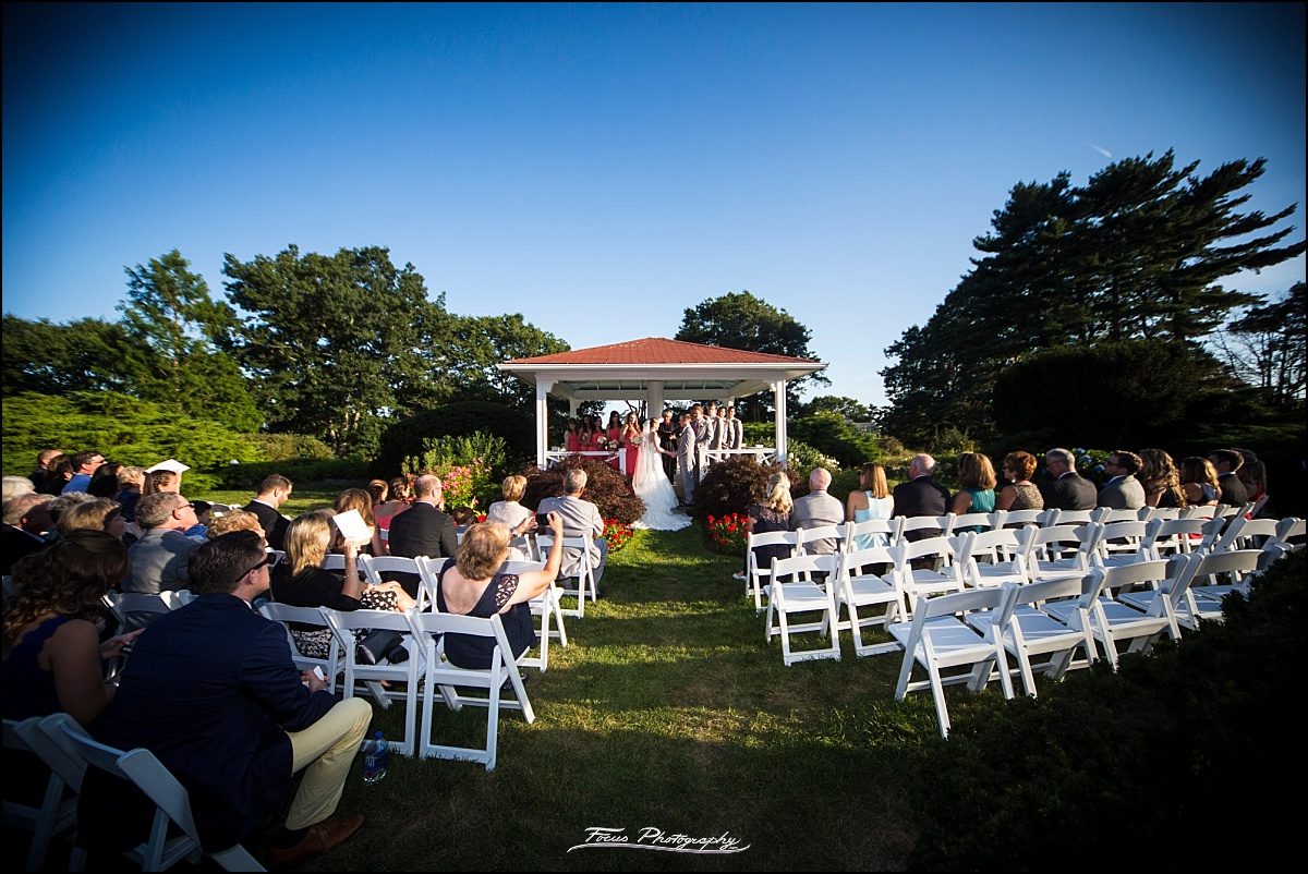 ceremony on back lawn at Wentworth by the Sea wedding in New Castle, NH