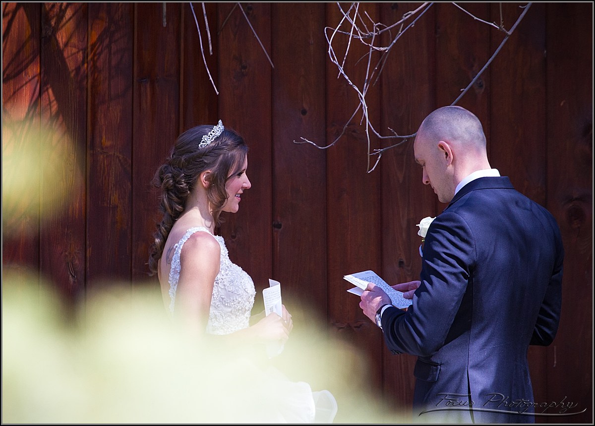 couple reading wedding vows