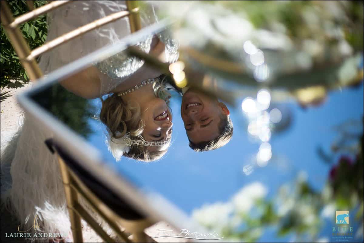 wedding couple reflected in table