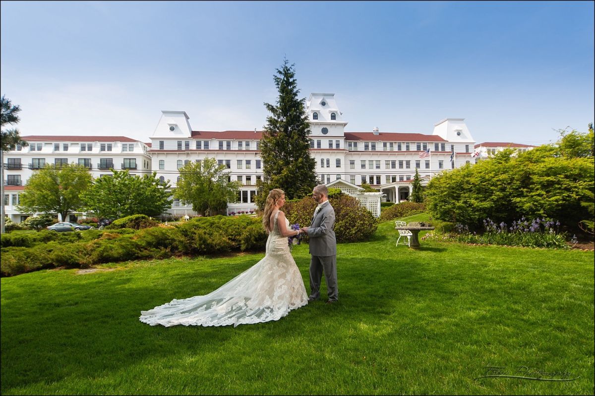 bride and groom in front of the Wentworth by the sea hotel for their wedding