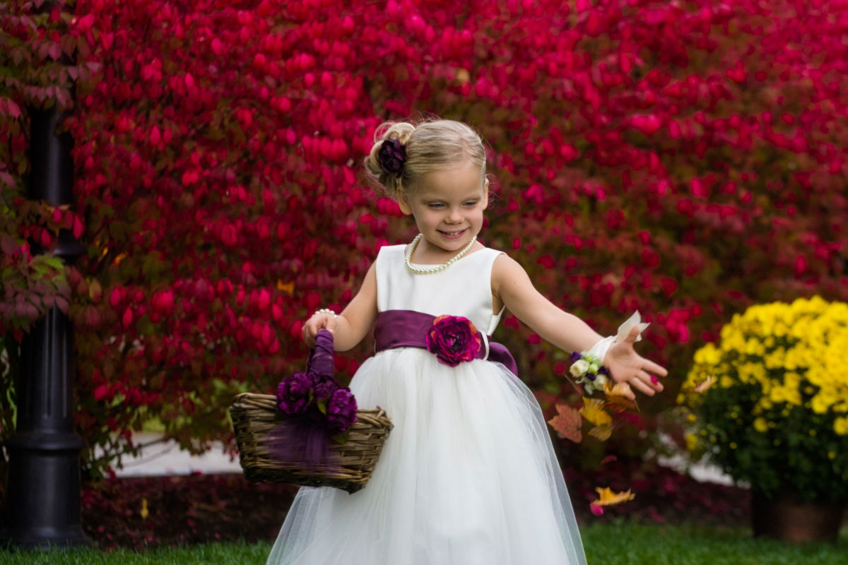 South Berwick, Maine wedding photography, flower girl spreading leaves