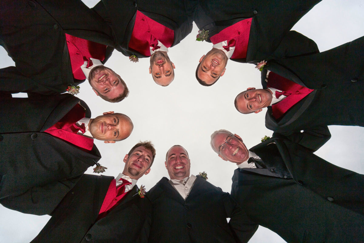 Red Barn Wedding, grooms men looking down