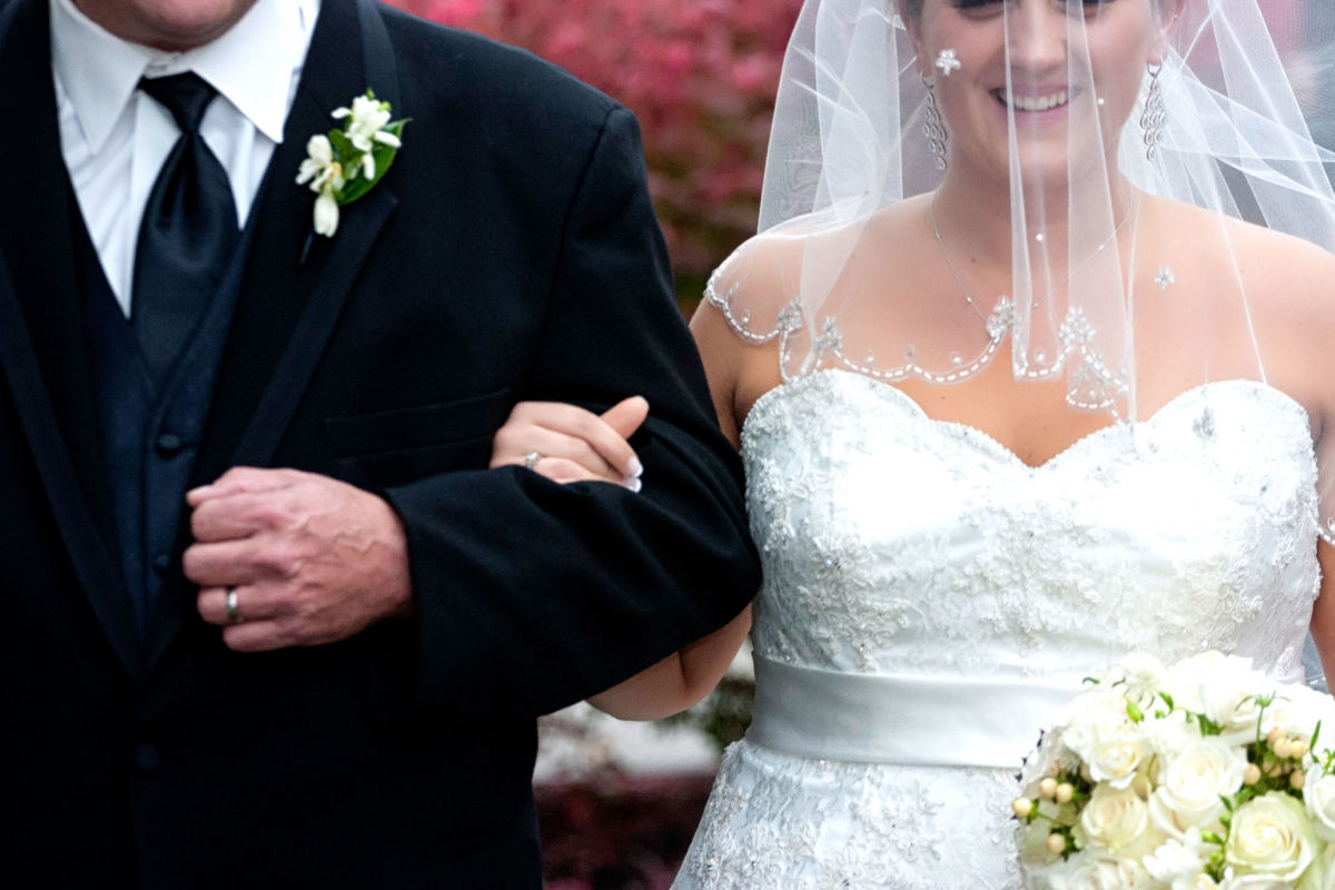 Red Barn Wedding, close up of bride and father escorting her