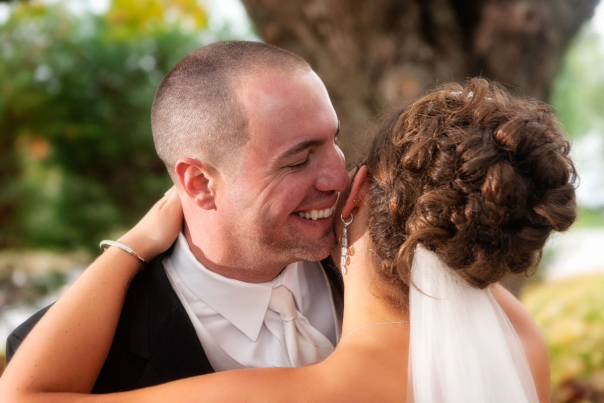 Red Barn Wedding, couple laughing together outdoors