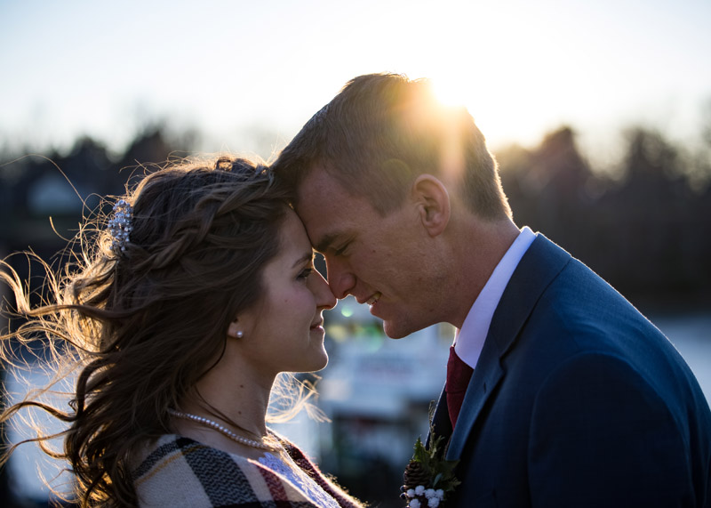 a wedding couple at the harbor in a December day.