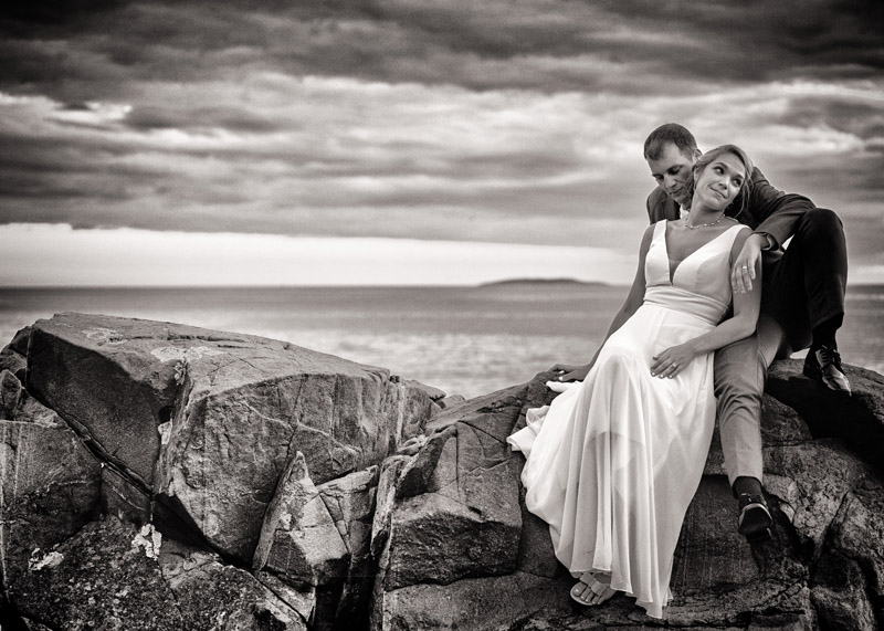 wedding couple photographed on rocks at Newagen Inn in Southport, Maine