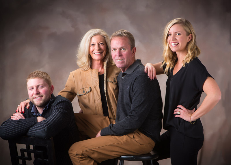 This family portrait was taken in our professional photography studio in Maine with family wearing brown and black. Families that regularly create images of themselves stay closer over time, and have better looking Christmas cards!