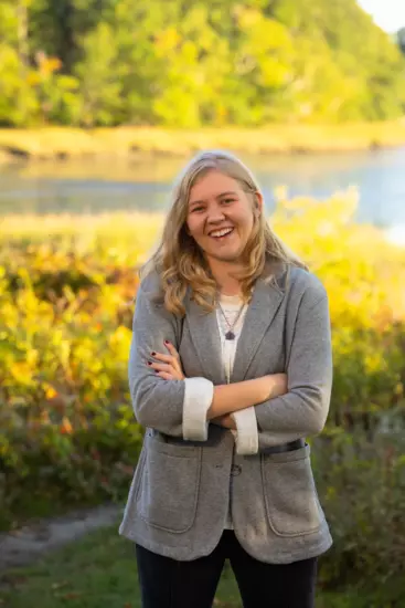 maine high school senior girl in woods for outdoor senior portrait with professional photographer